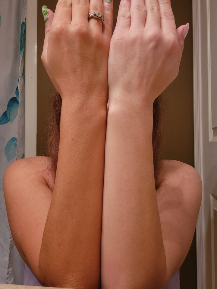 Comparison of a tan arm using Skinny Dip Tanning Water to a natural skin coloured arm.